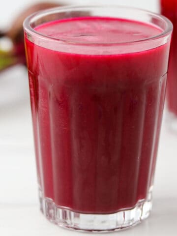 Close up of a glass of beet juice.