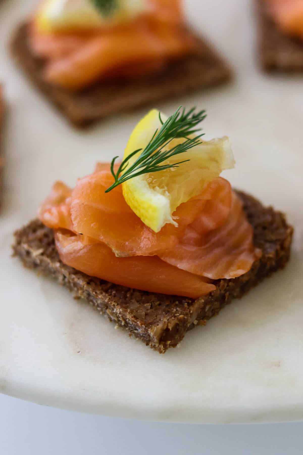 Gravlax (cured salmon) on rye bread with lemon and dill.