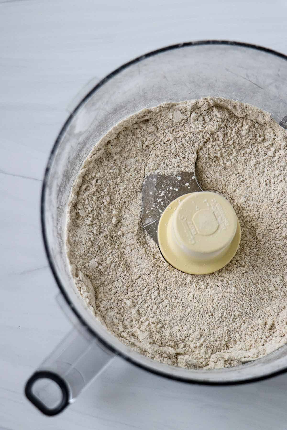 Flour in the work bowl of a food processor.