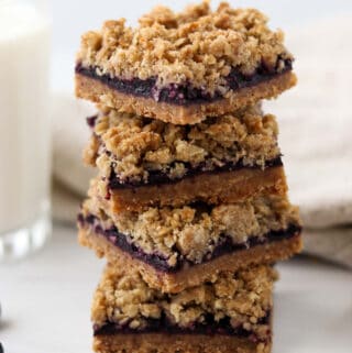 Close up of a stack of Lemon Blueberry Crumble Bars.