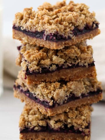 Close up of a stack of Lemon Blueberry Crumble Bars.
