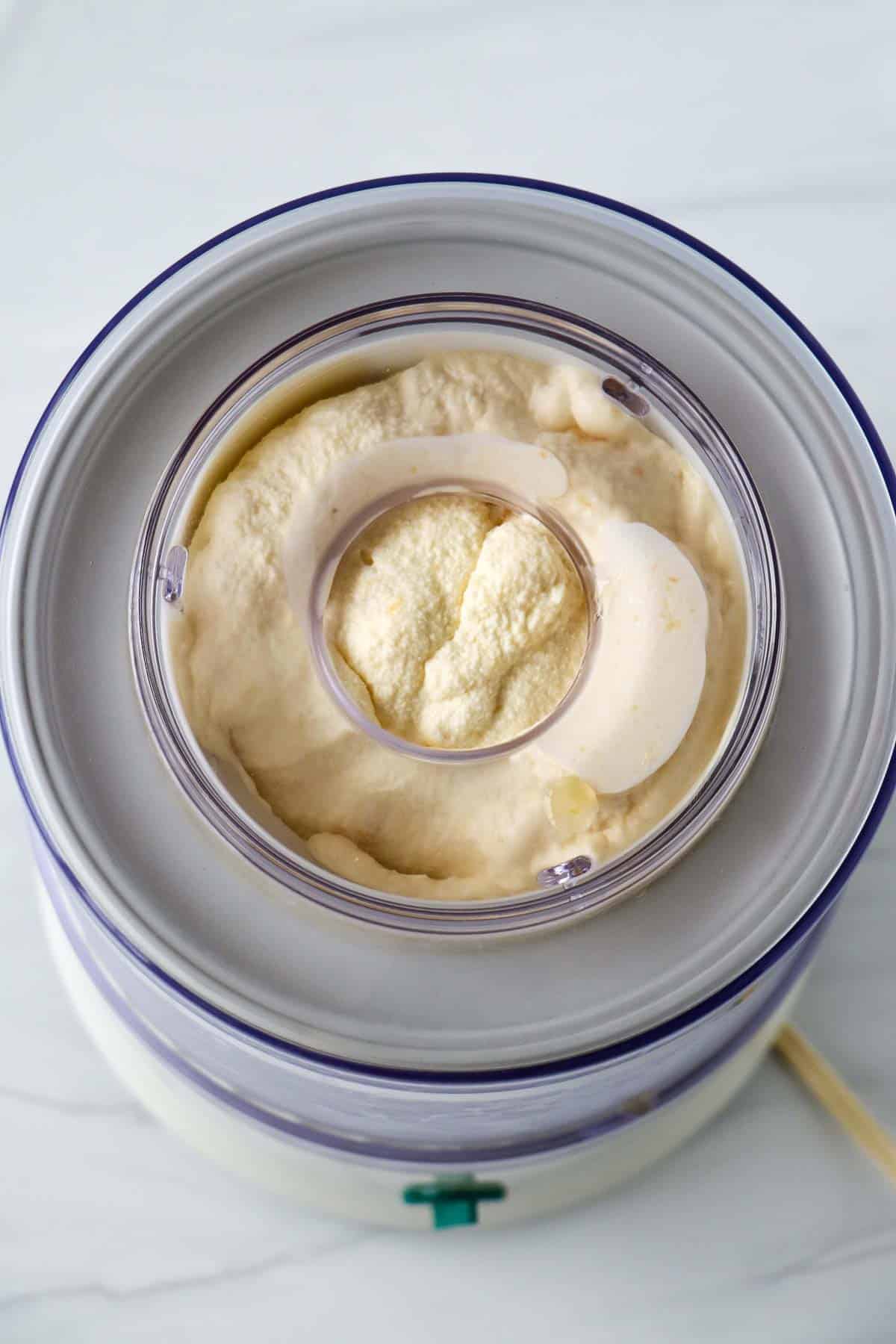 Ice cream maker filled with peaches and cream ice cream.