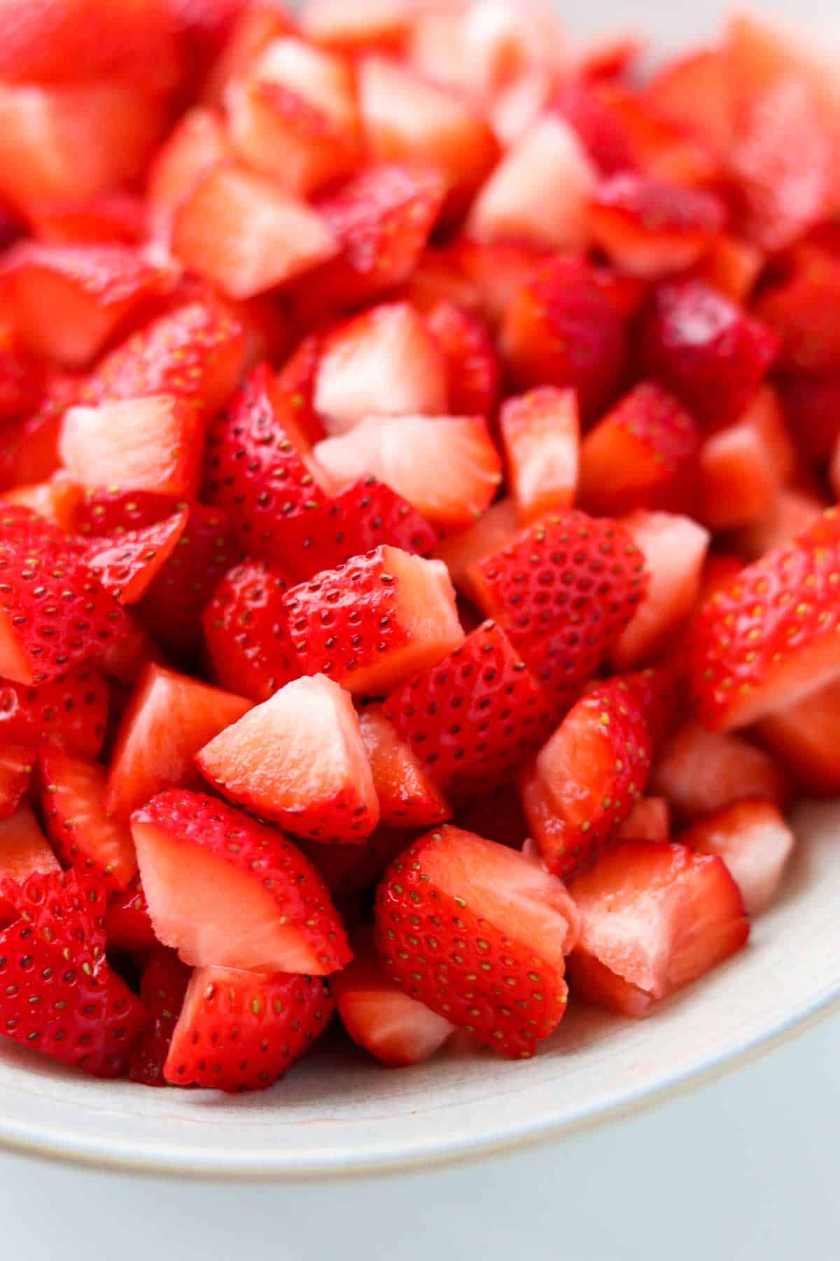 Close up of cut up strawberries.
