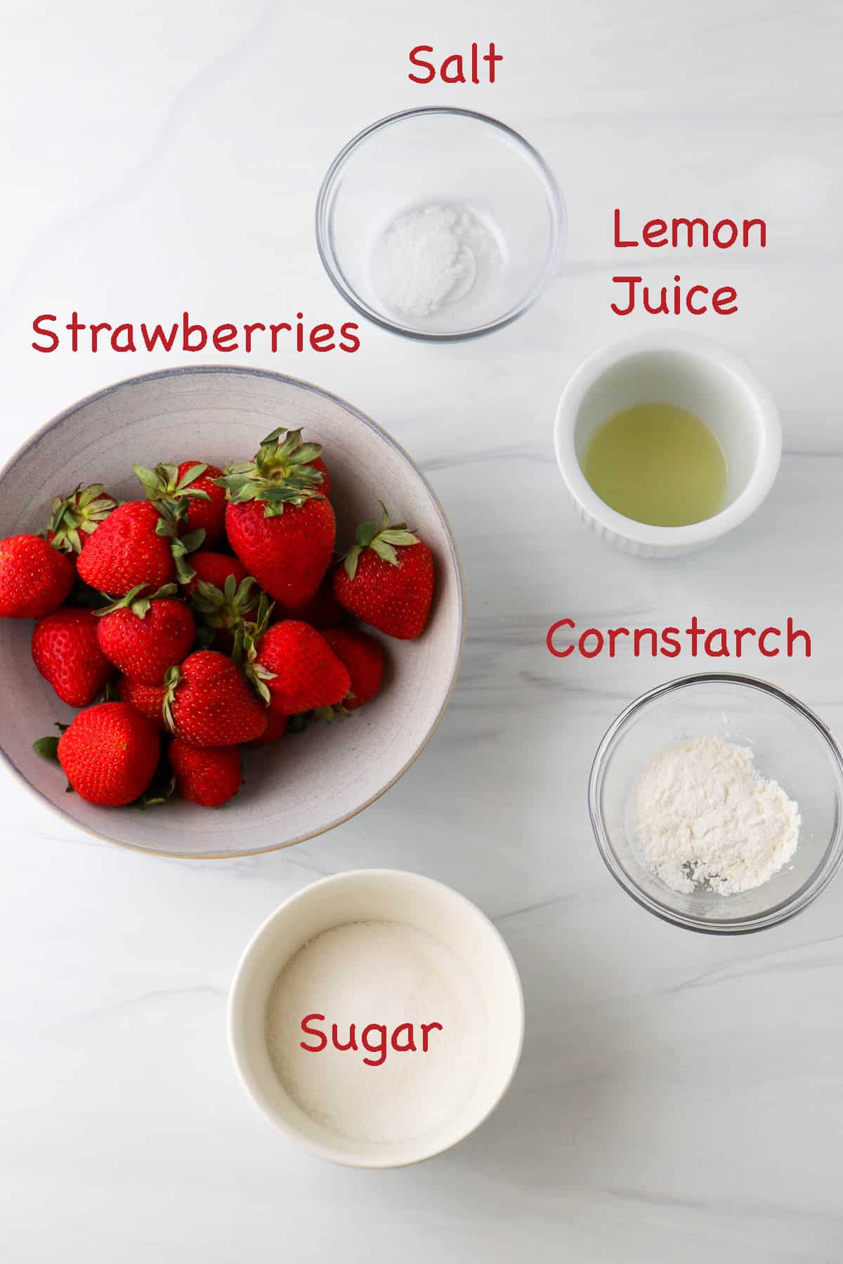 Labeled ingredients for homemade strawberry filling for Strawberry Roll Cake.
