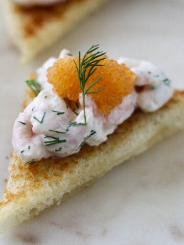 Close up of Toast Skagen topped with caviar.