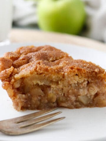 Swedish Apple Pie on a plate with a fork.
