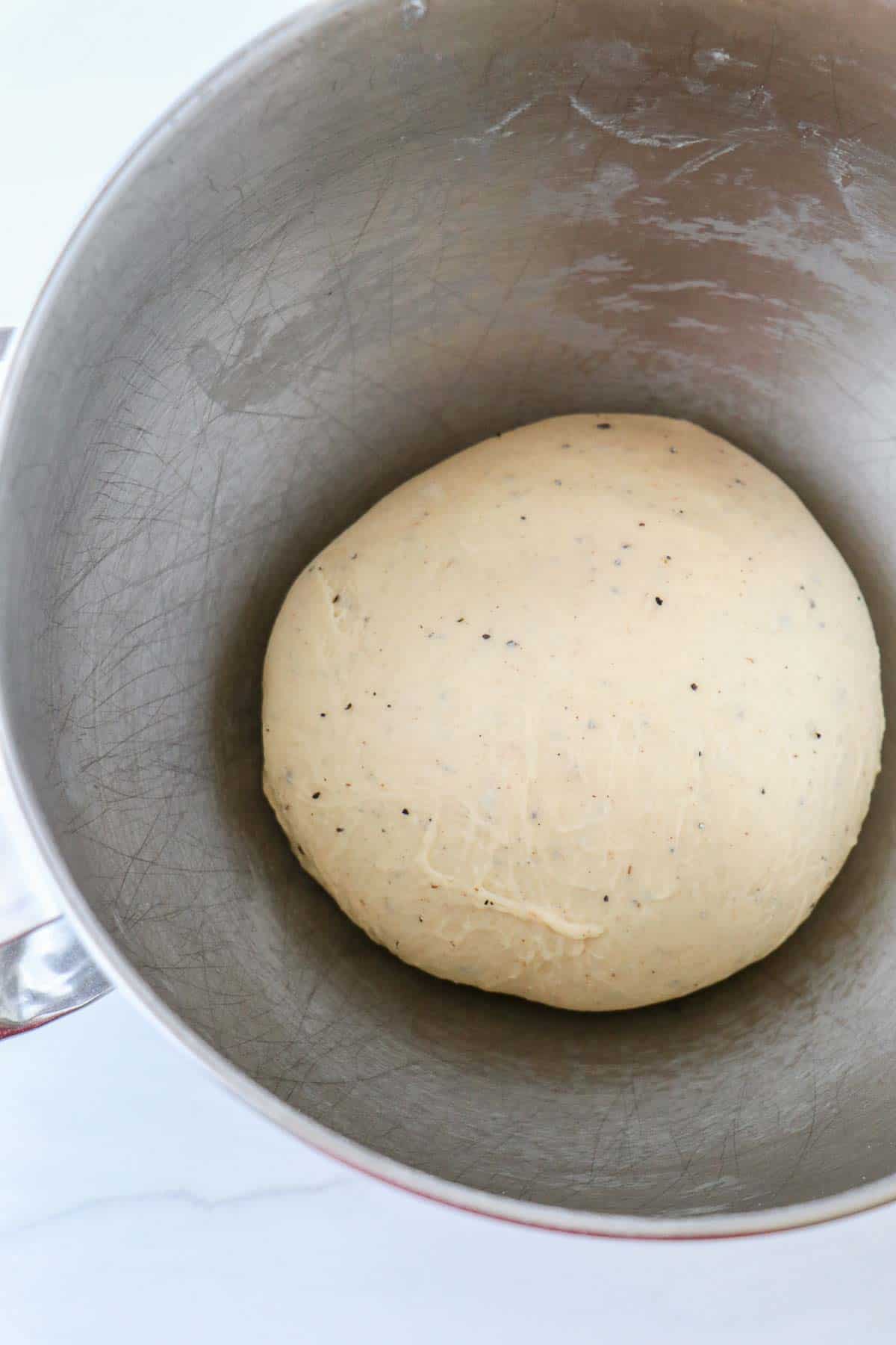 Cardamom dough in a metal bowl.