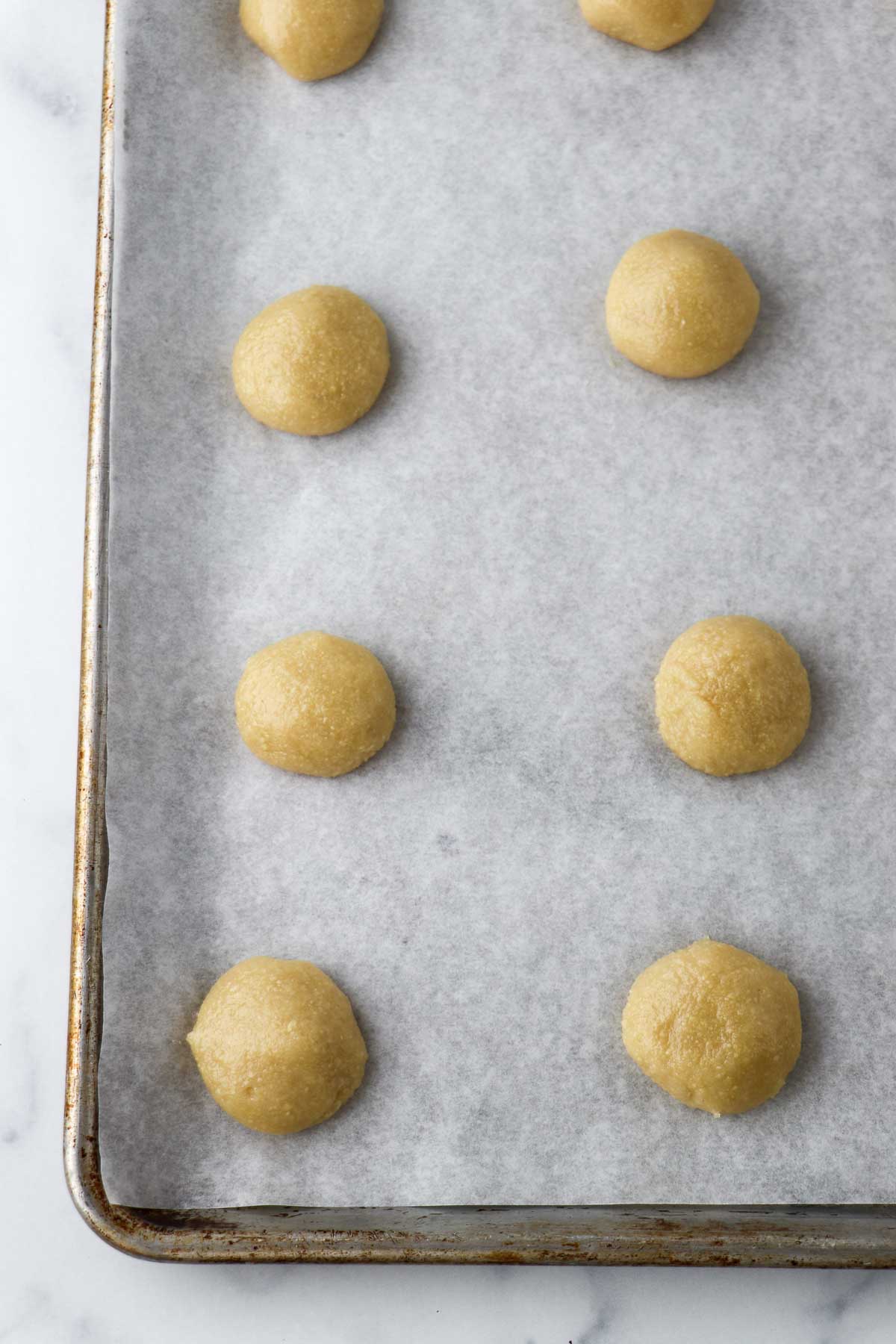 Unbaked Almond Macaroons on a baking sheet.