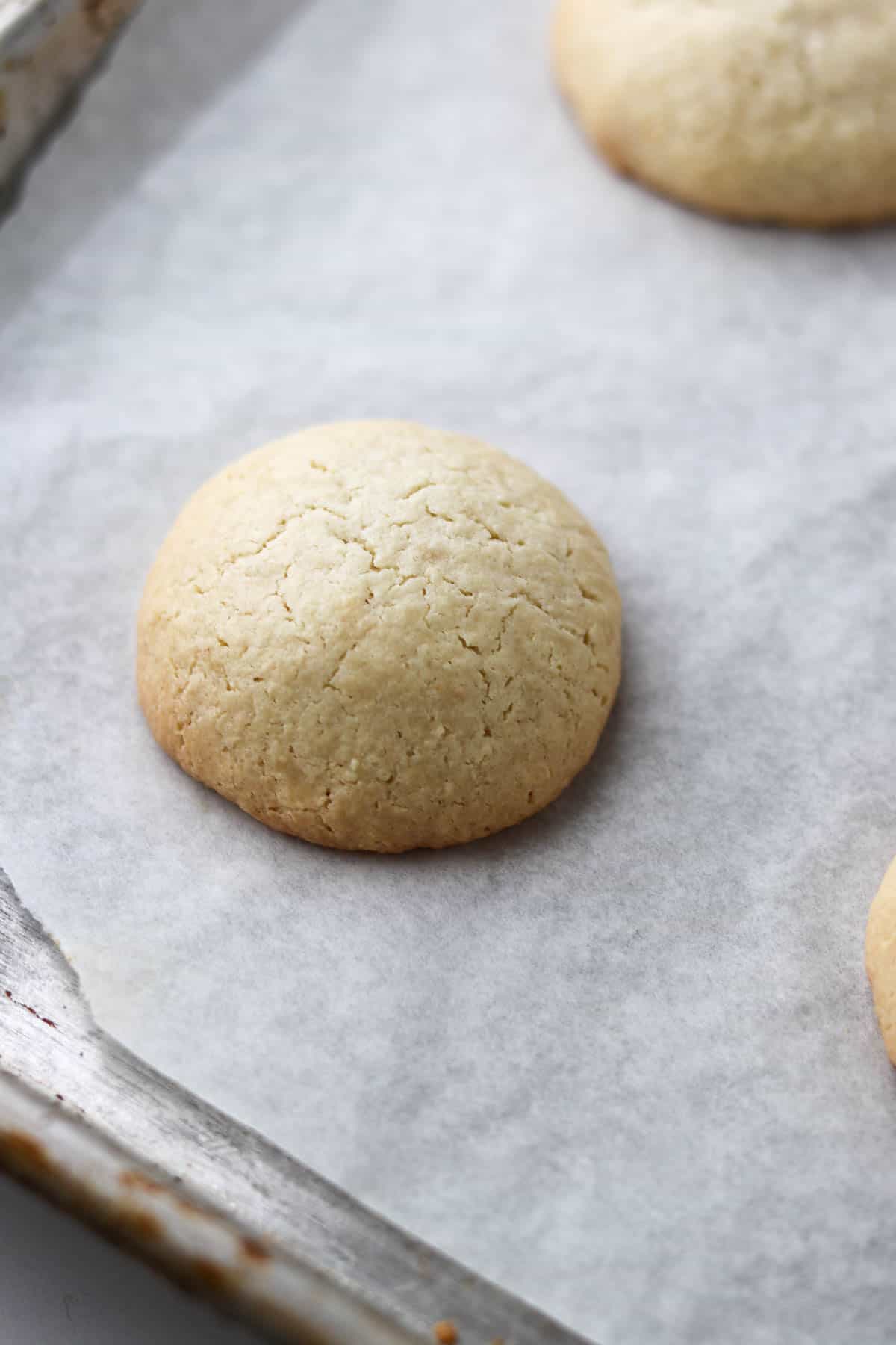 Close up of an Easy Almond Macaroon on a baking sheet.