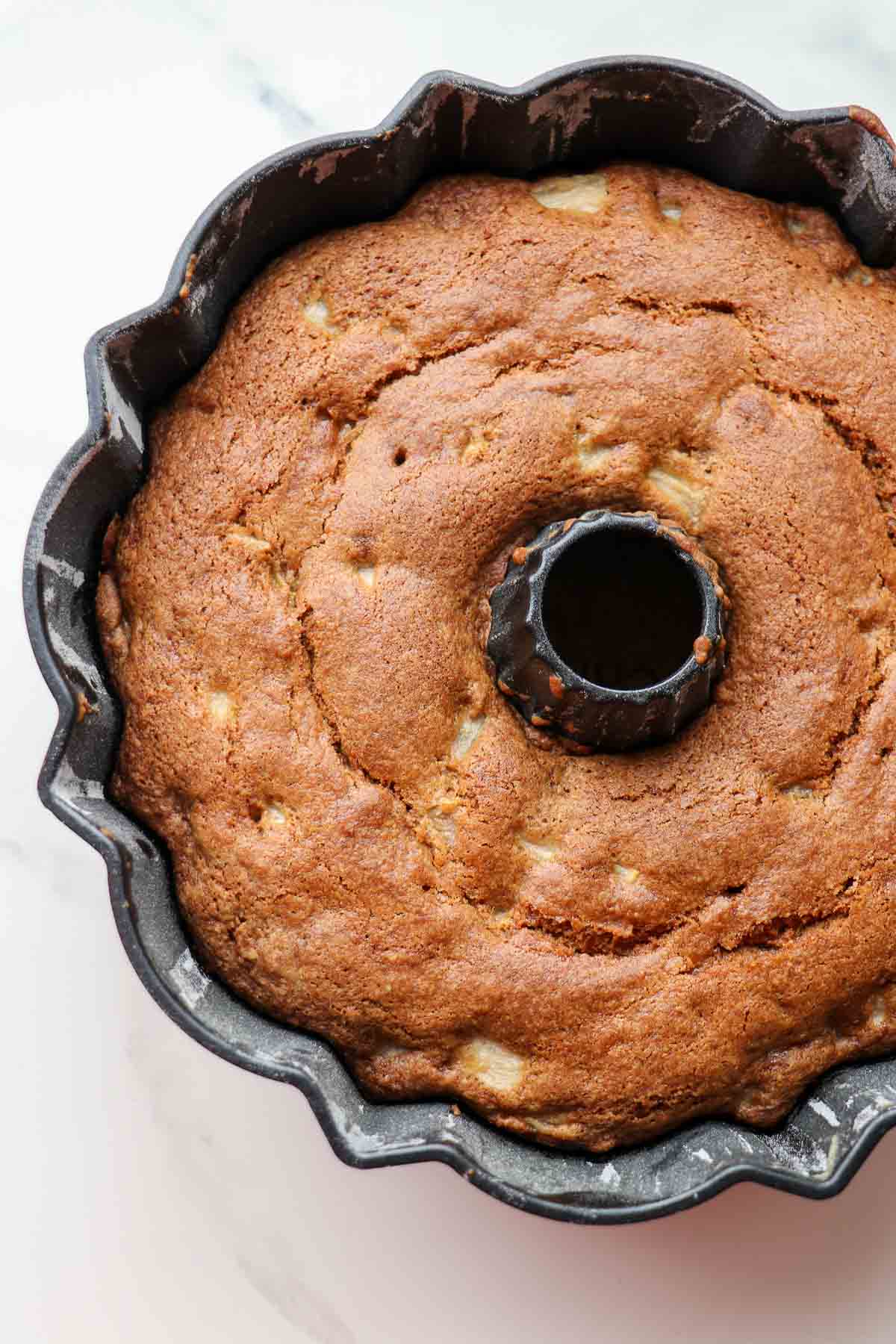Baked Spiced Pear Cake with Cardamom in a bundt pan.