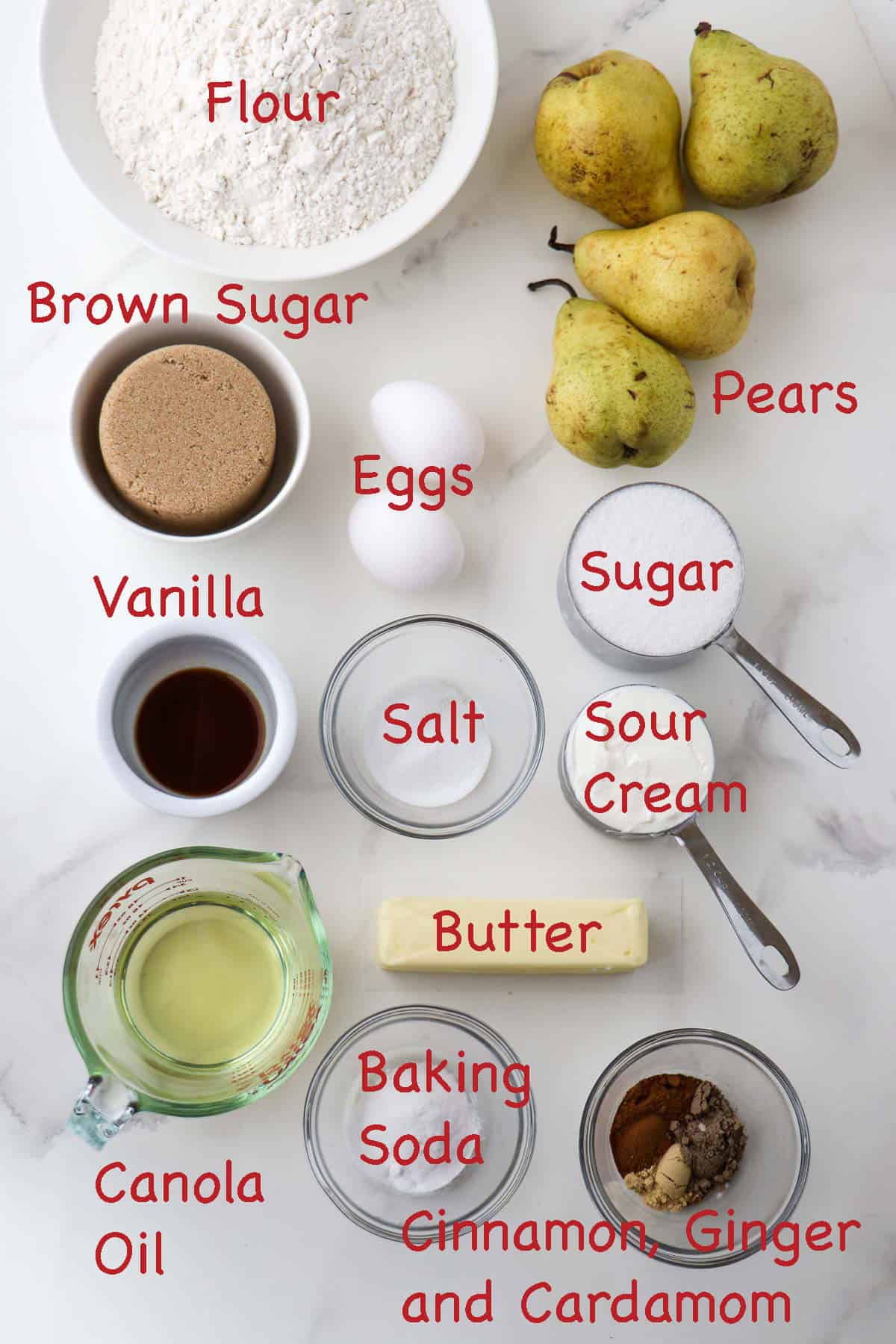 Labeled ingredients for Spiced Pear Cake with Cardamom.