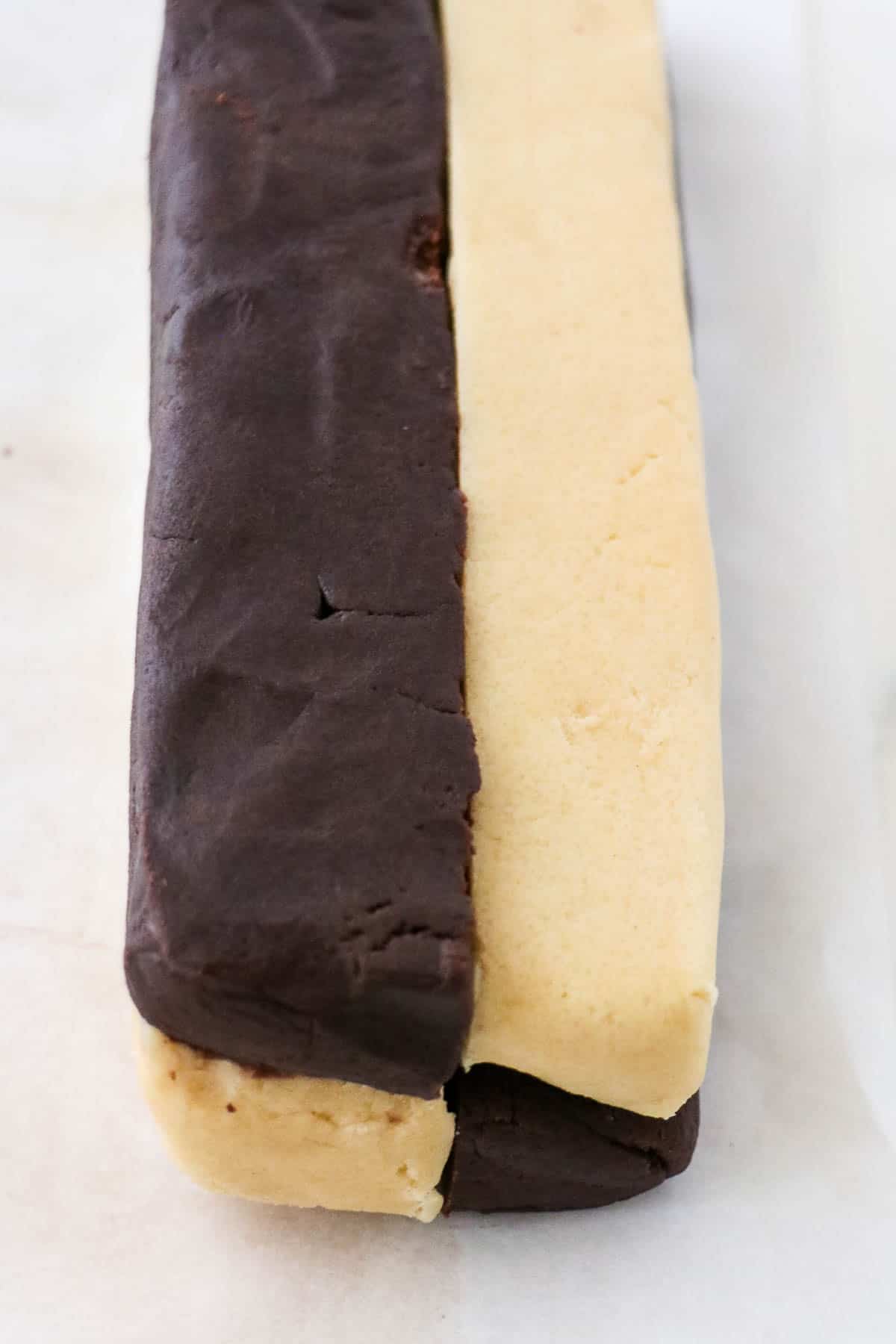 Alternating layers of chocolate and vanilla cookie dough in a log shape.