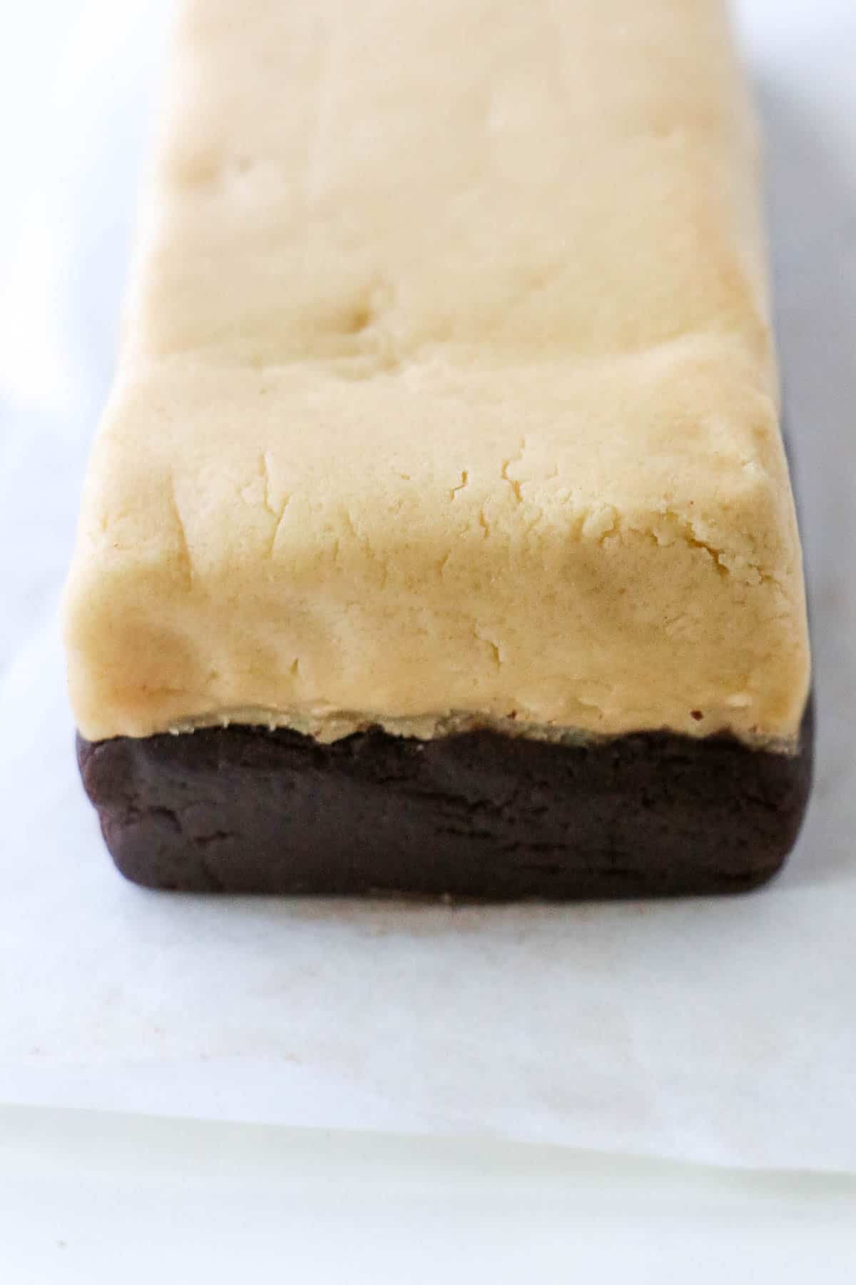 Two rectangle layers of cookies dough on top of each other.