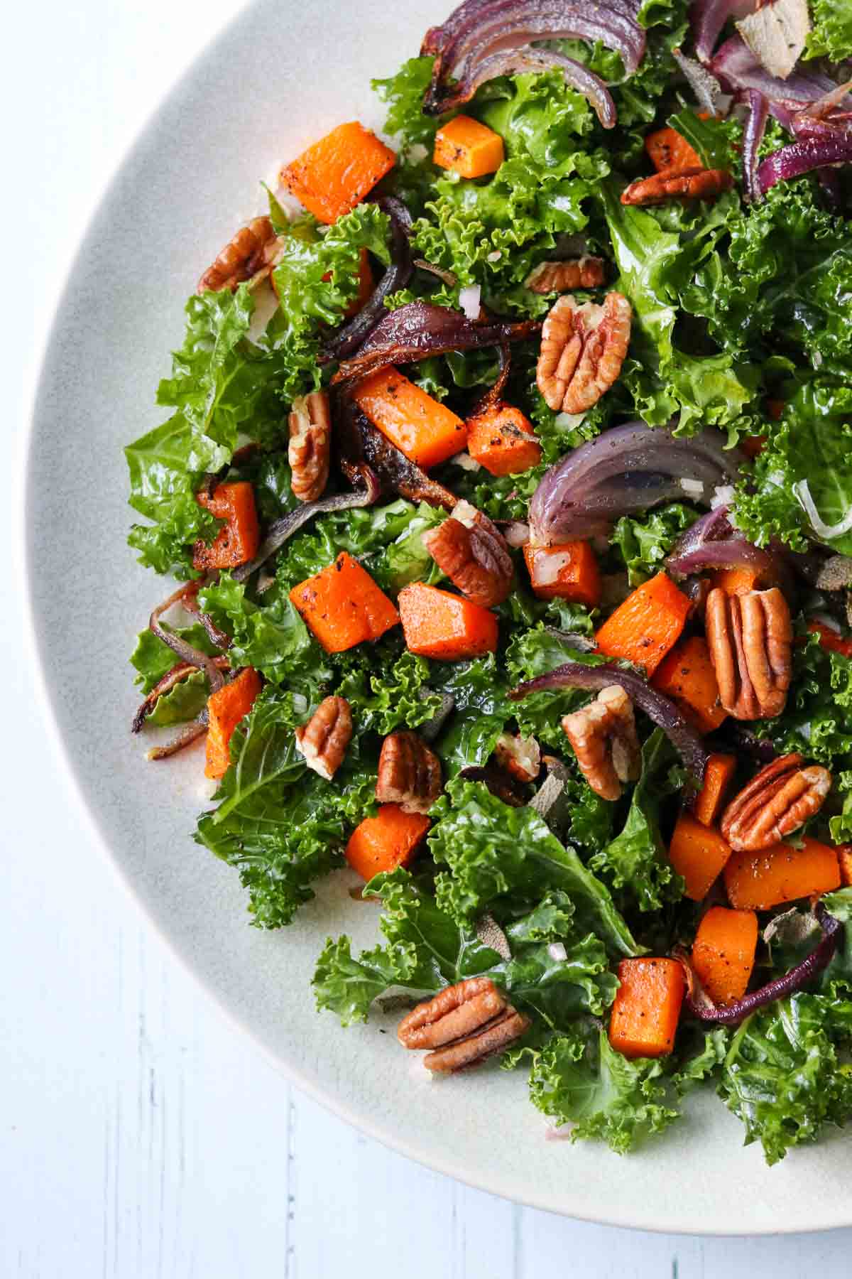 Kale and Butternut Squash Salad on a white plate.