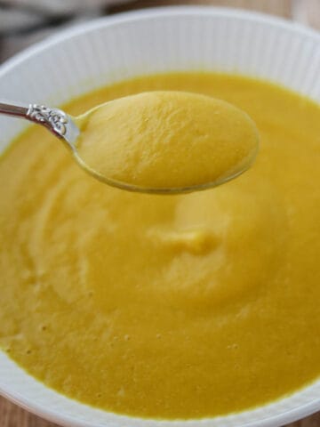 Close up of Golden Beet Soup on a spoon.