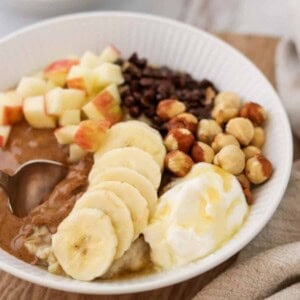 Close up of an Ultimate Oatmeal Bowl with a spoon.