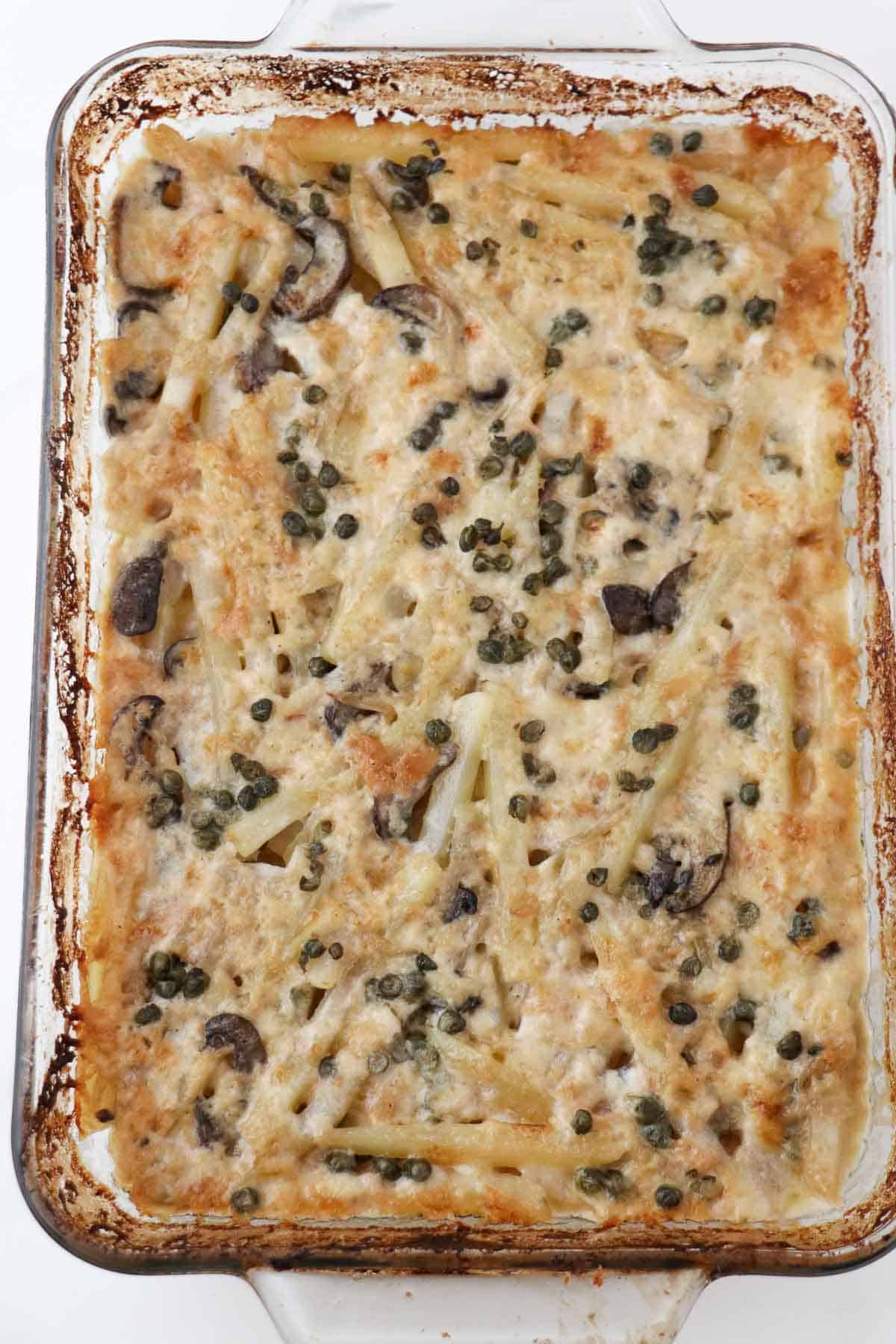 Fully baked Vegetarian Jansson's Temptation in a glass baking dish.