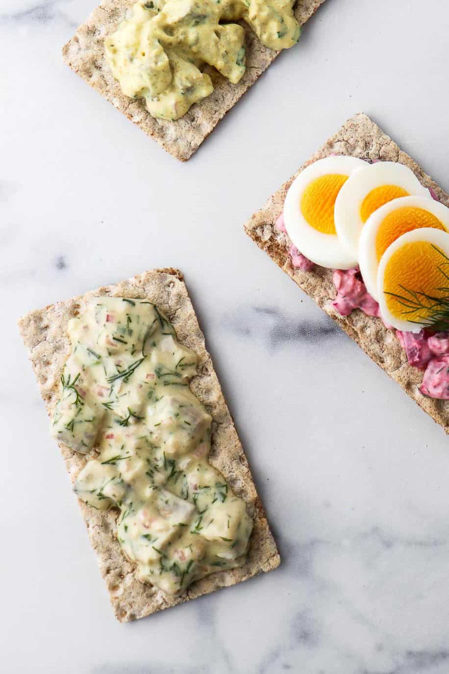 Swedish Mustard Herring on a rye crisp cracker.