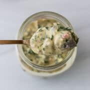 Swedish Mustard Herring on a spoon.