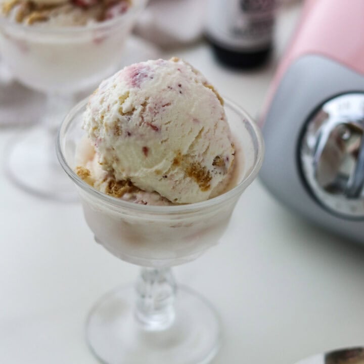 Lingonberry Cheesecake Ice Cream in a glass dish.