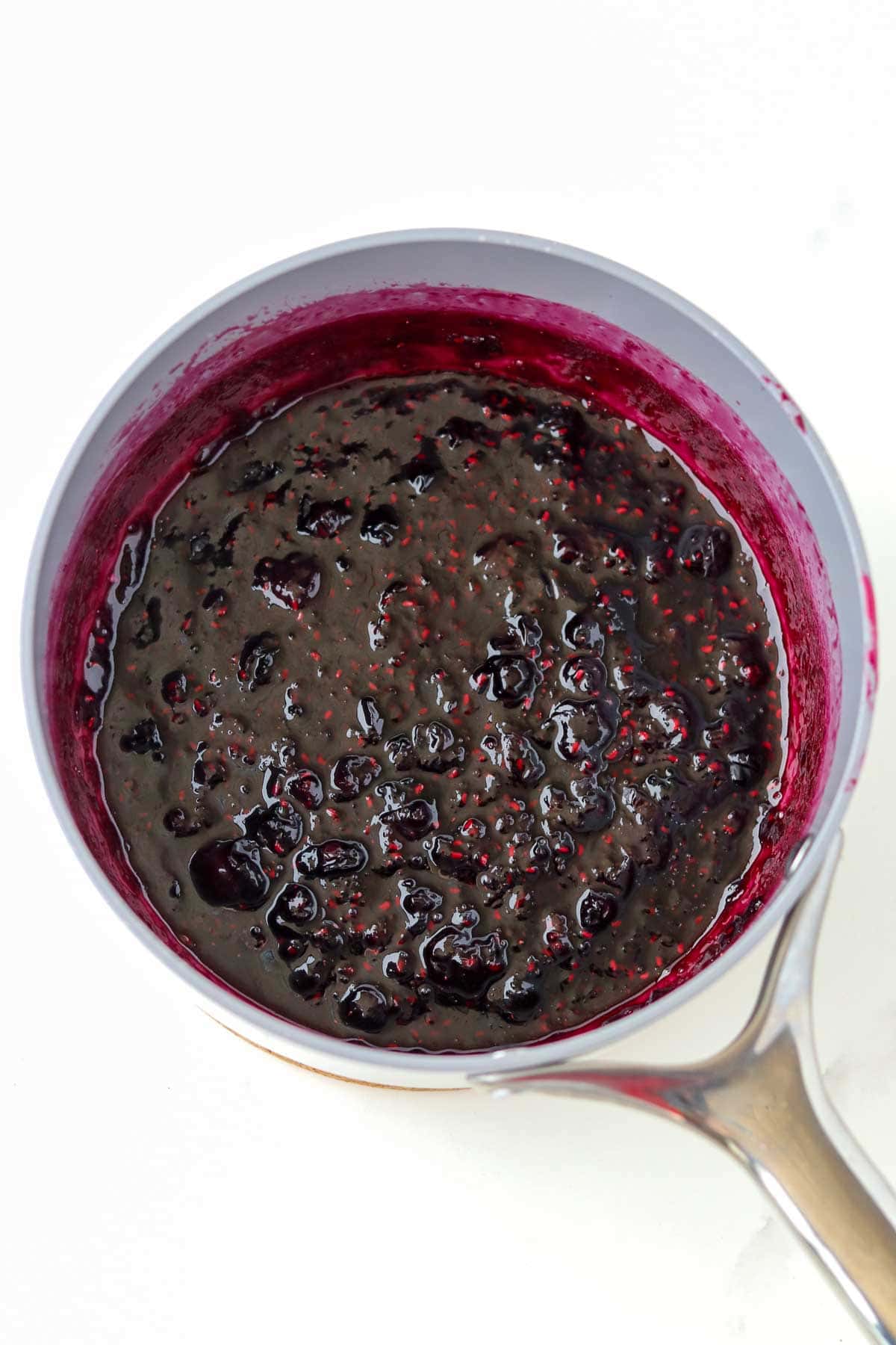 Swedish Queen's Jam (Blueberry Raspberry Jam) inside a gray sauce pan.