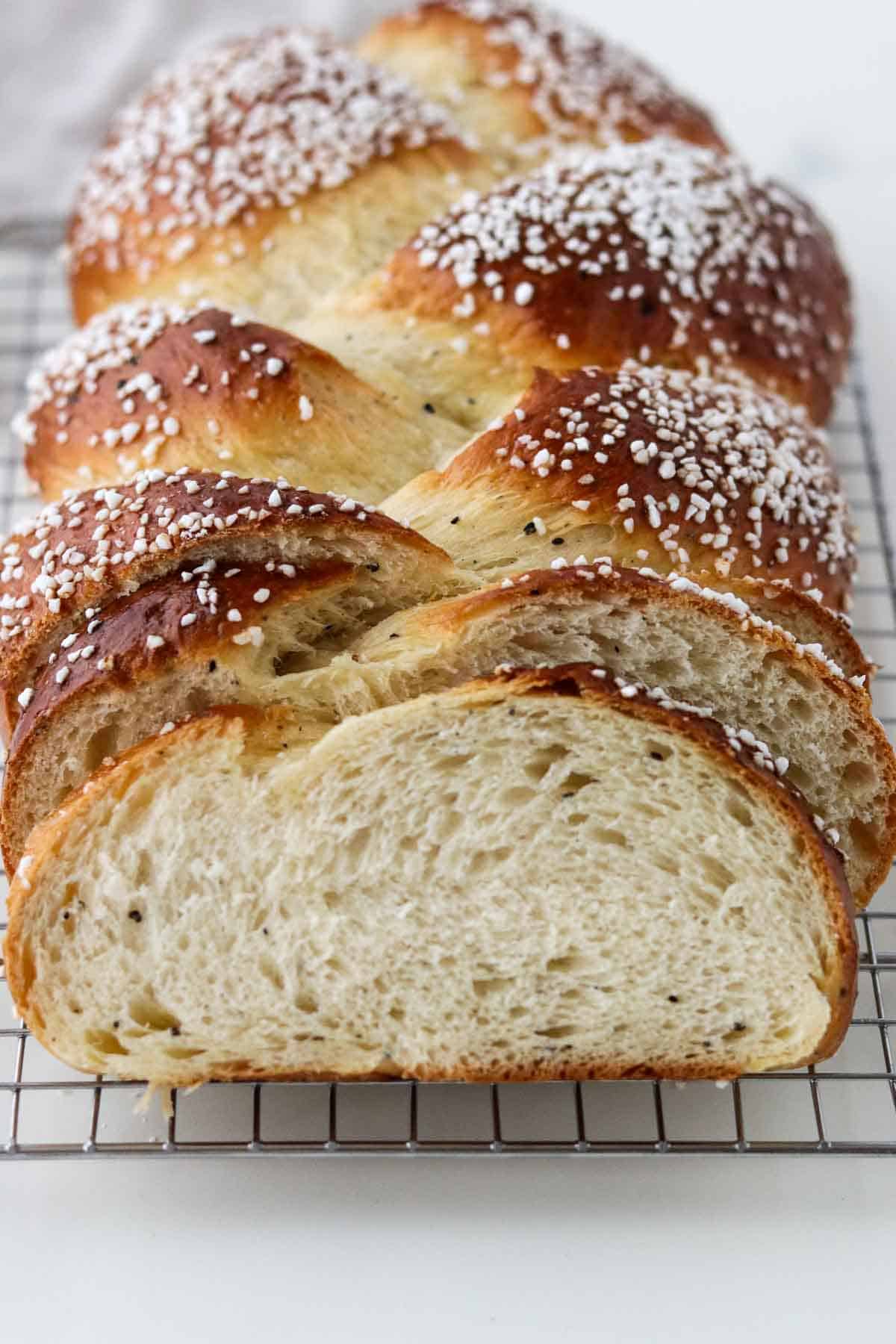 Braided Cardamom Bread loaf on a cooling rack.