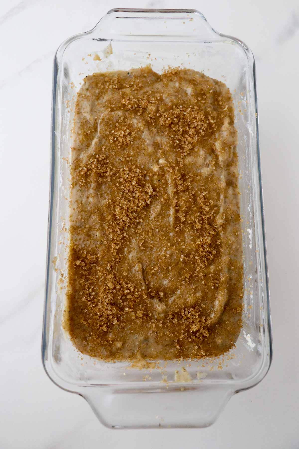 Cardamom Banana Bread batter in a glass bread pan.