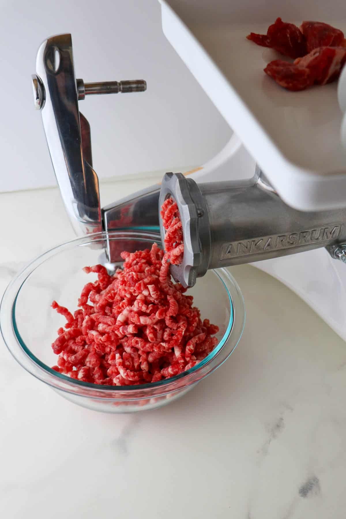 Ankarsrum Mincer attatchment grinding beef.