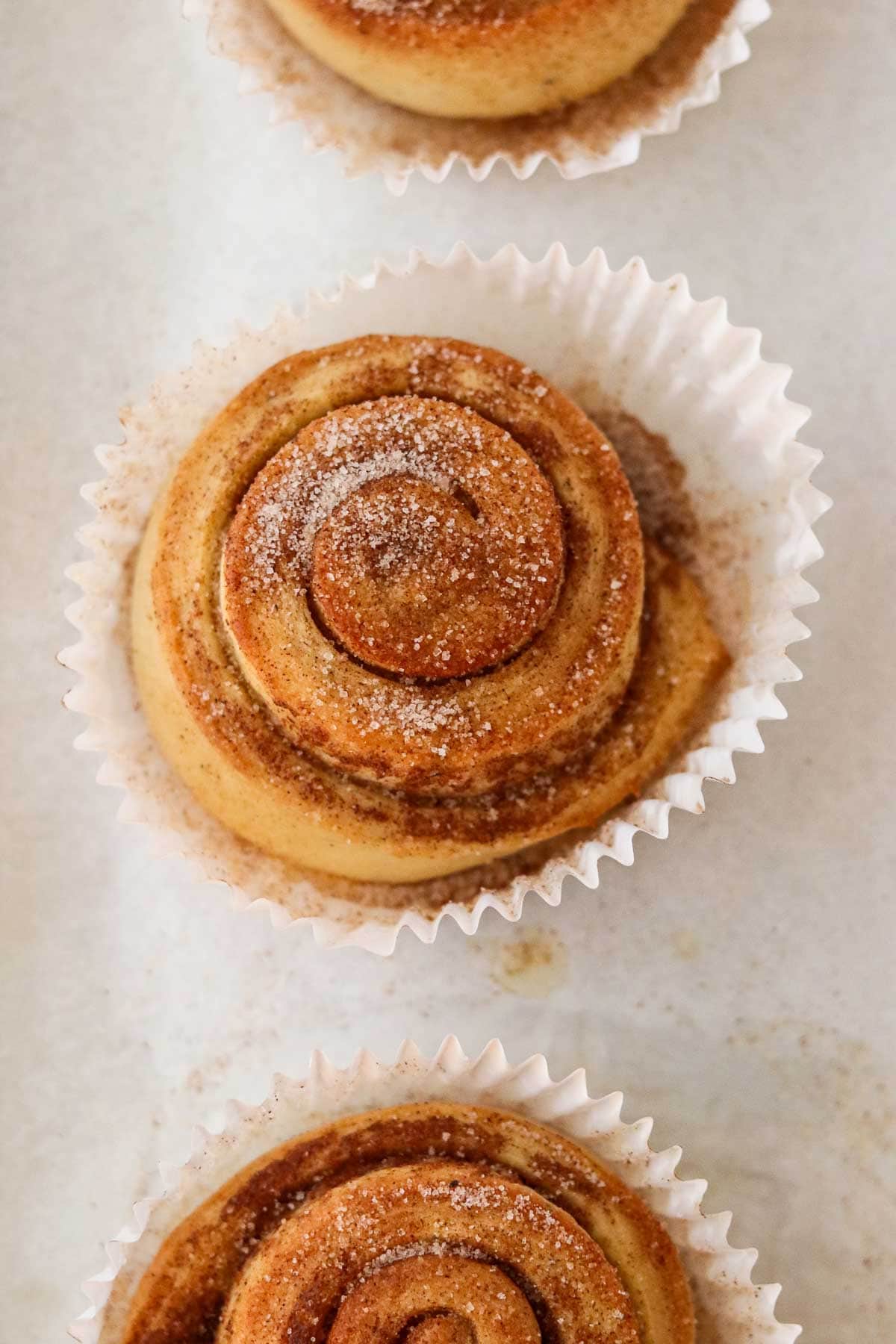 Norwegian Cinnamon Buns (Skillingsboller) on a baking sheet.