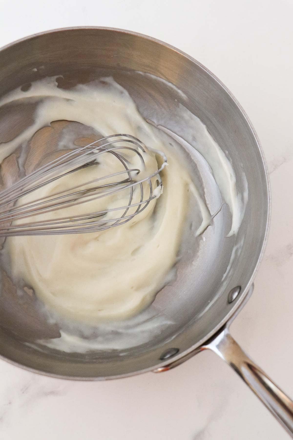 Flour, water and milk cooked together in a sauce pan with a whisk.