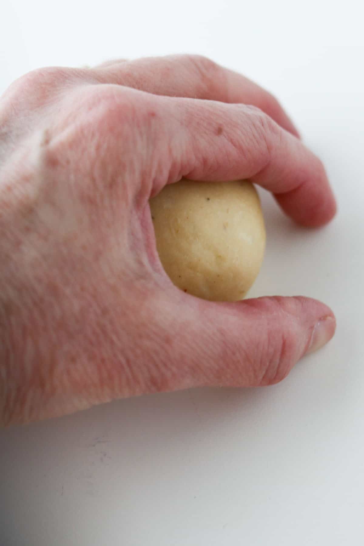 Person shaping a Norwegian Lenten Bun.