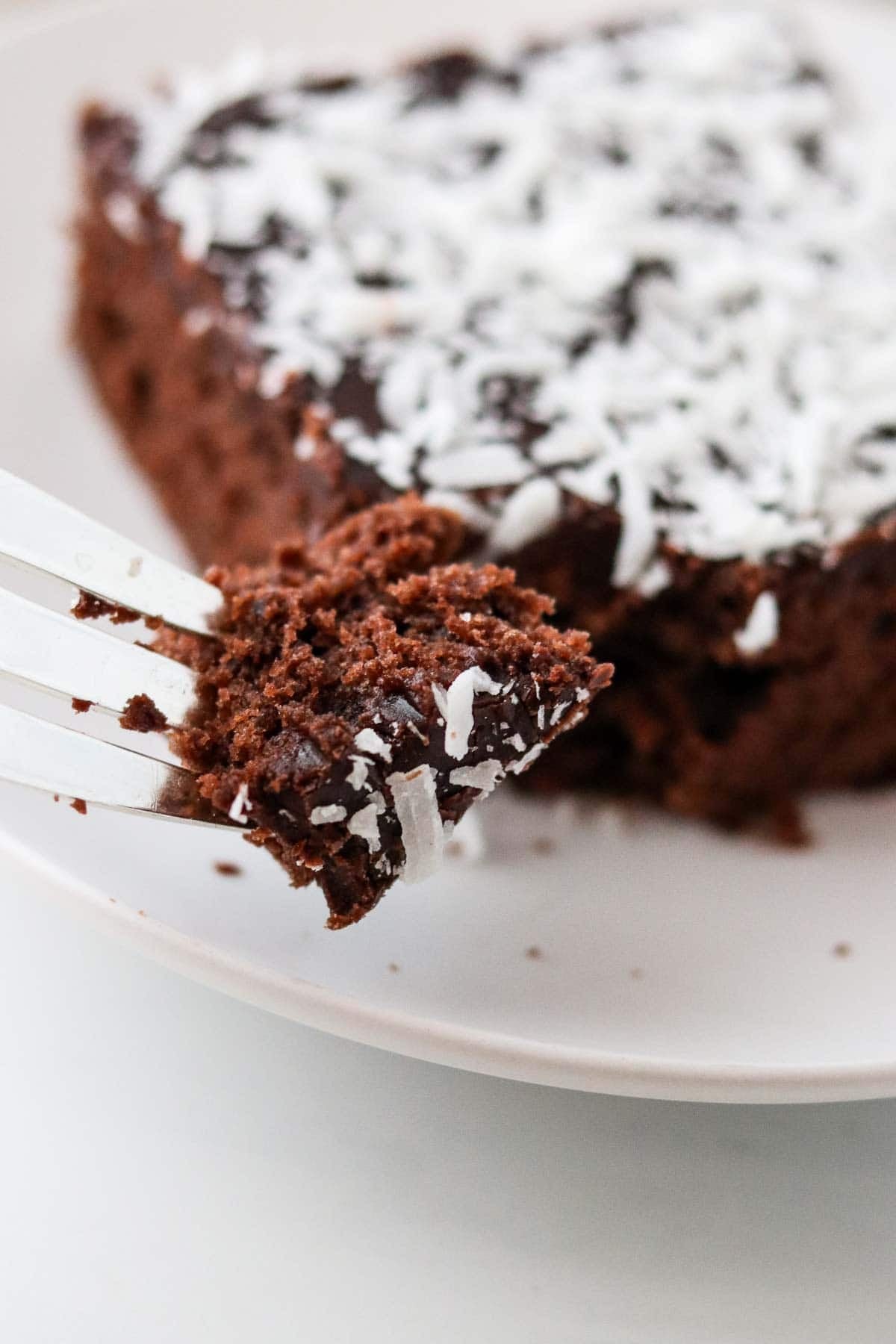 A bite of Swedish Love Cake (Kärleksmums) on a fork.