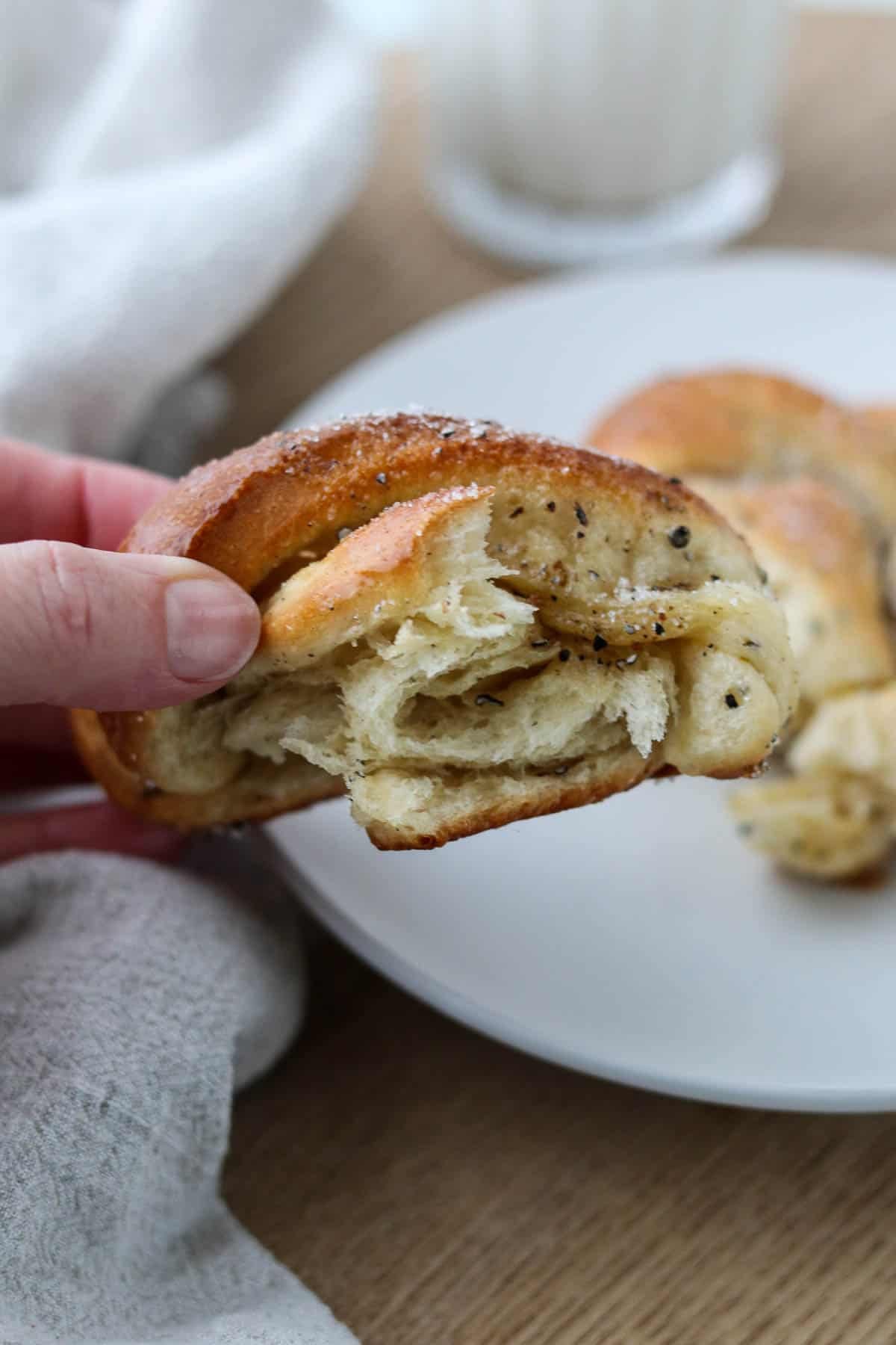 The inside a fluffy cardamom bun.