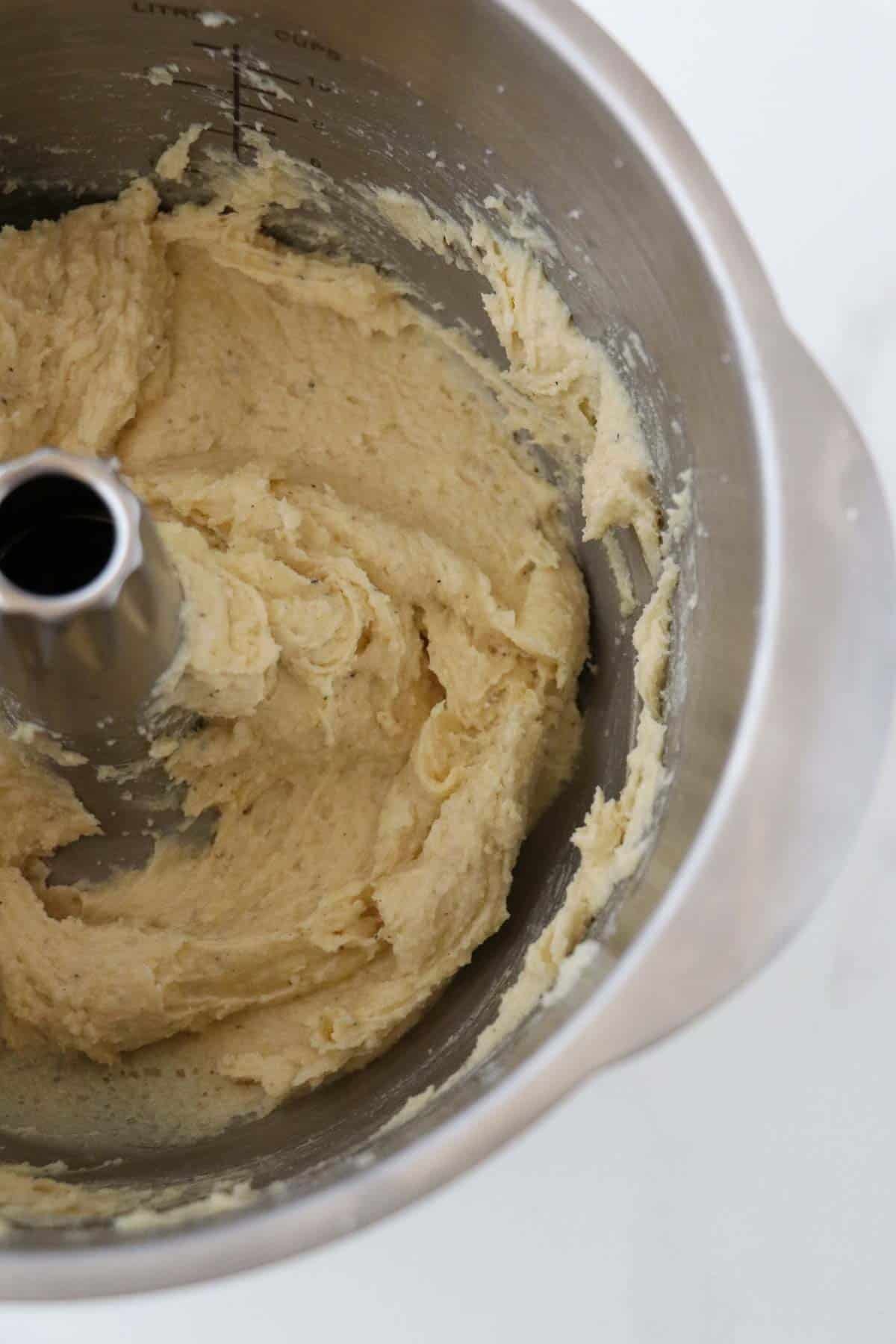 Almond frangipane in a mixer bowl.