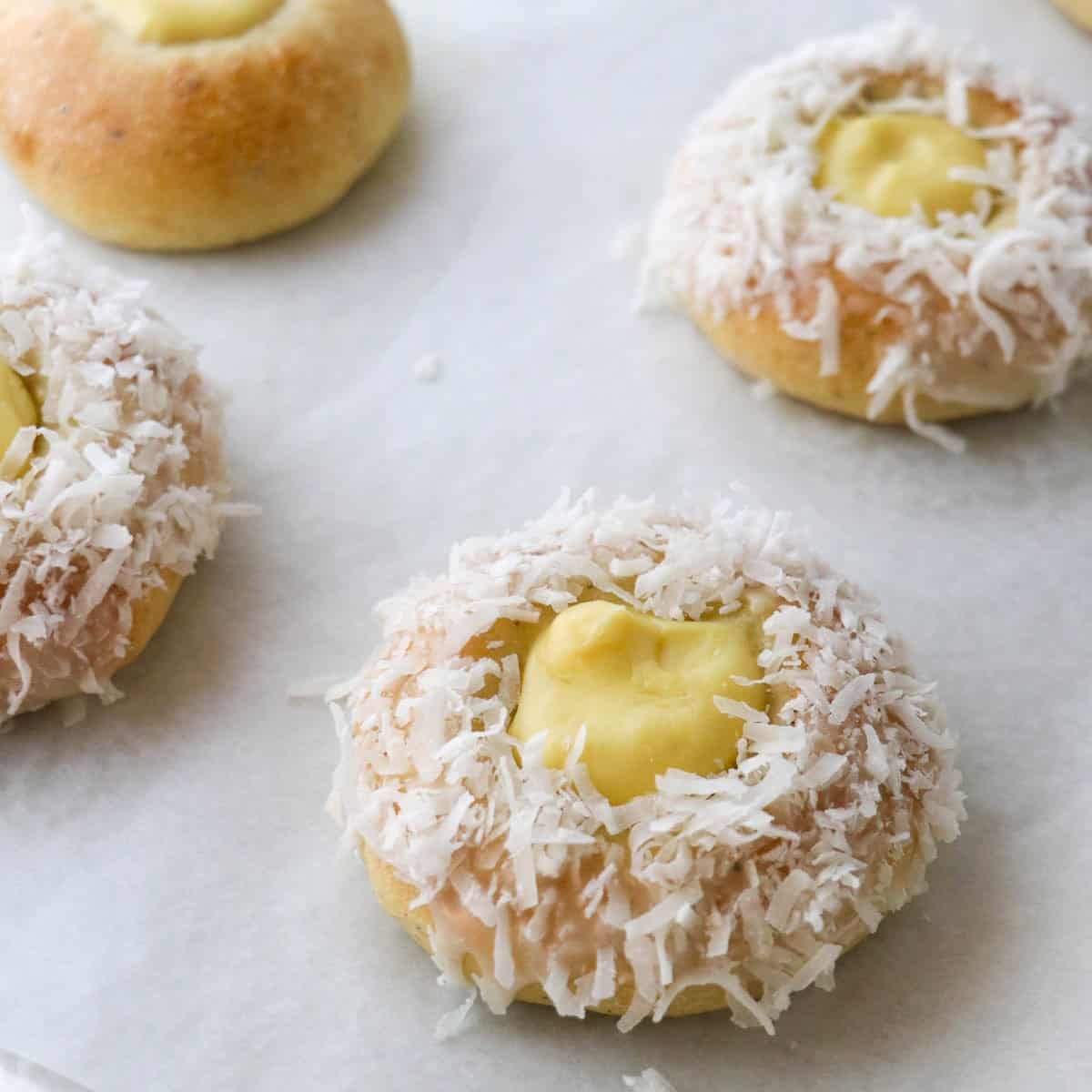 Norwegian Skoleboller on a baking sheet lined with parchment paper.
