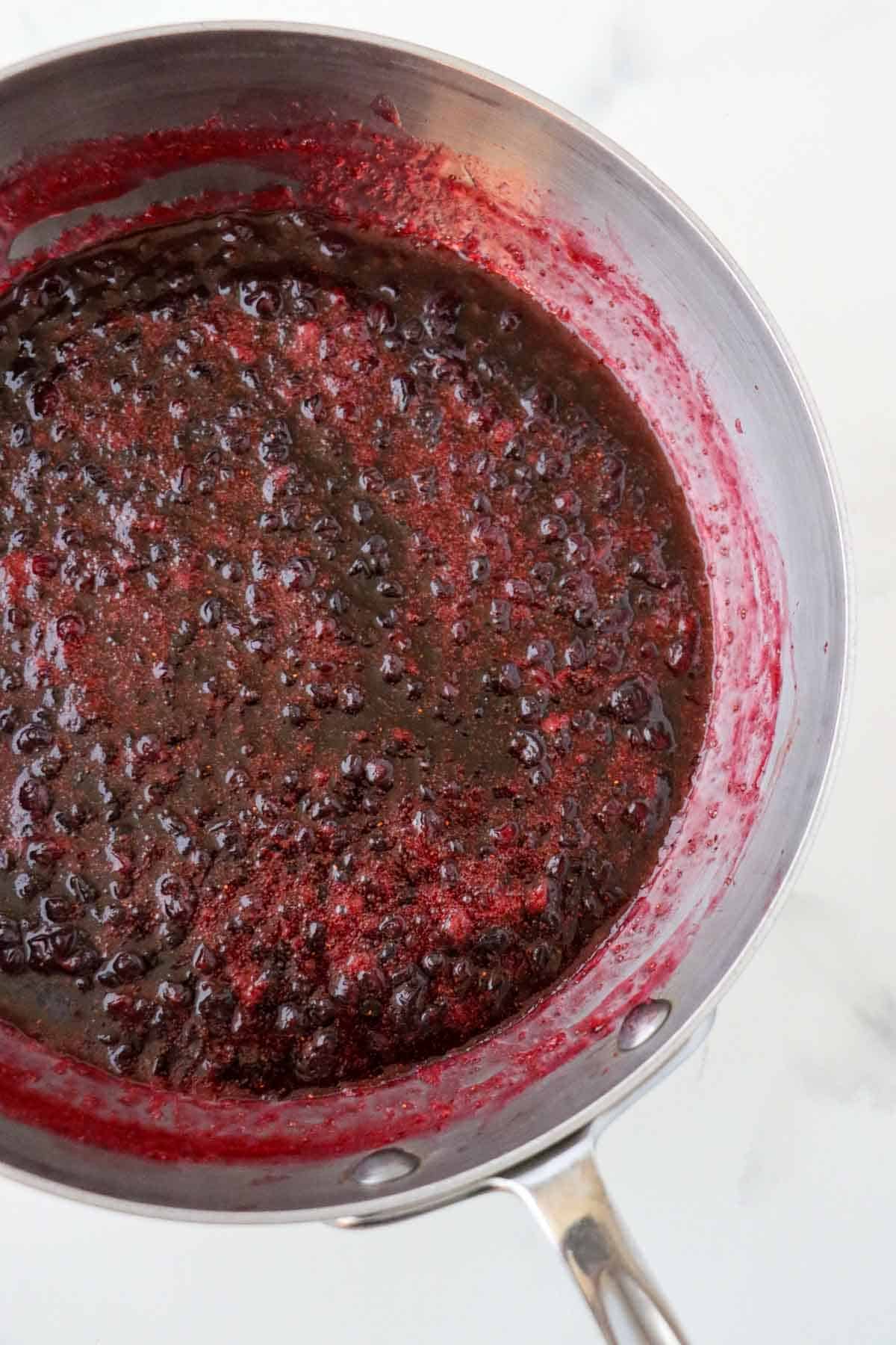 Just cooked Homemade Lingonberry Jam in a saucepan.